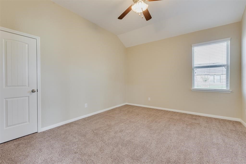 1903 Cadbury Castle Lane Fresno, TX 77545 - Photo 2 of 14 an empty room with a window