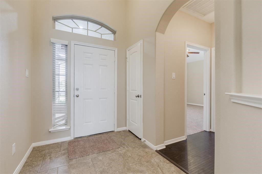 1903 Cadbury Castle Lane Fresno, TX 77545 - Photo 4 of 14 an empty room with wooden floor and closet