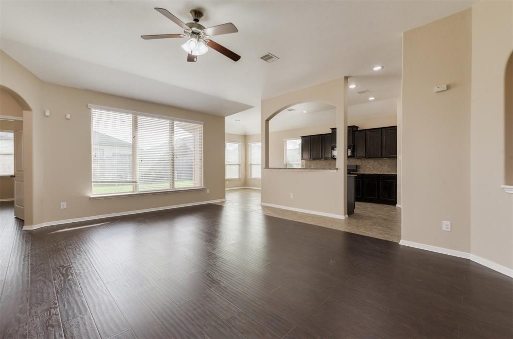 1903 Cadbury Castle Lane Fresno, TX 77545 - Photo 9 of 14 a view of a kitchen with a stove cabinets and wooden floor