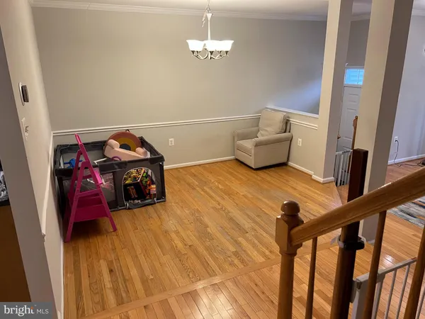 a view of a livingroom with furniture and toys