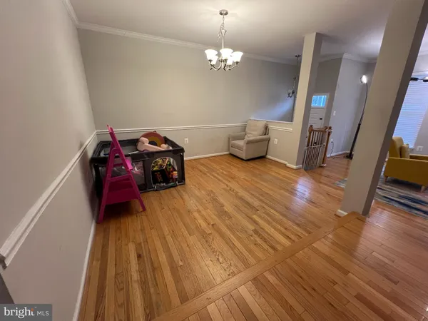 a living room with furniture and a mirror