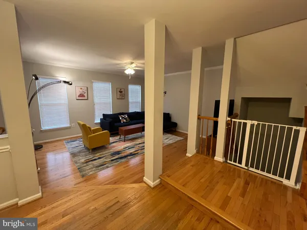 a view of a living room and entryway