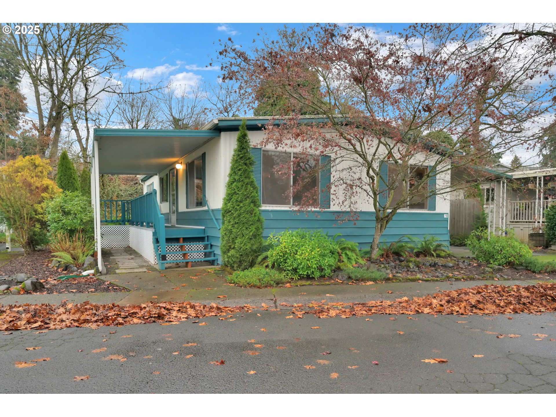a front view of house with a garden
