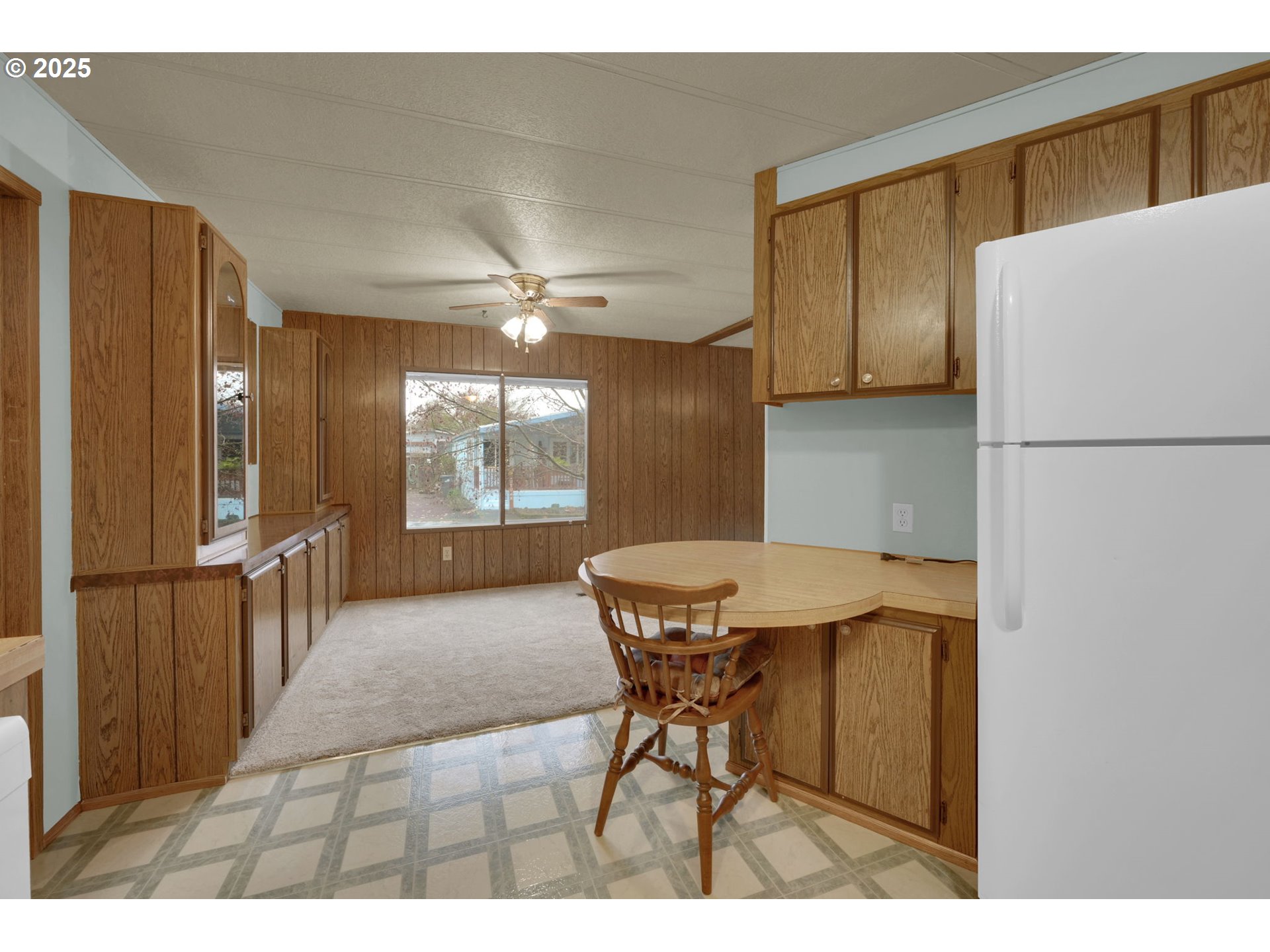 1475 Green Acres Road, Unit 13 Eugene, OR 97408 - Photo 14 of 39 a view of a dining room with furniture and a window