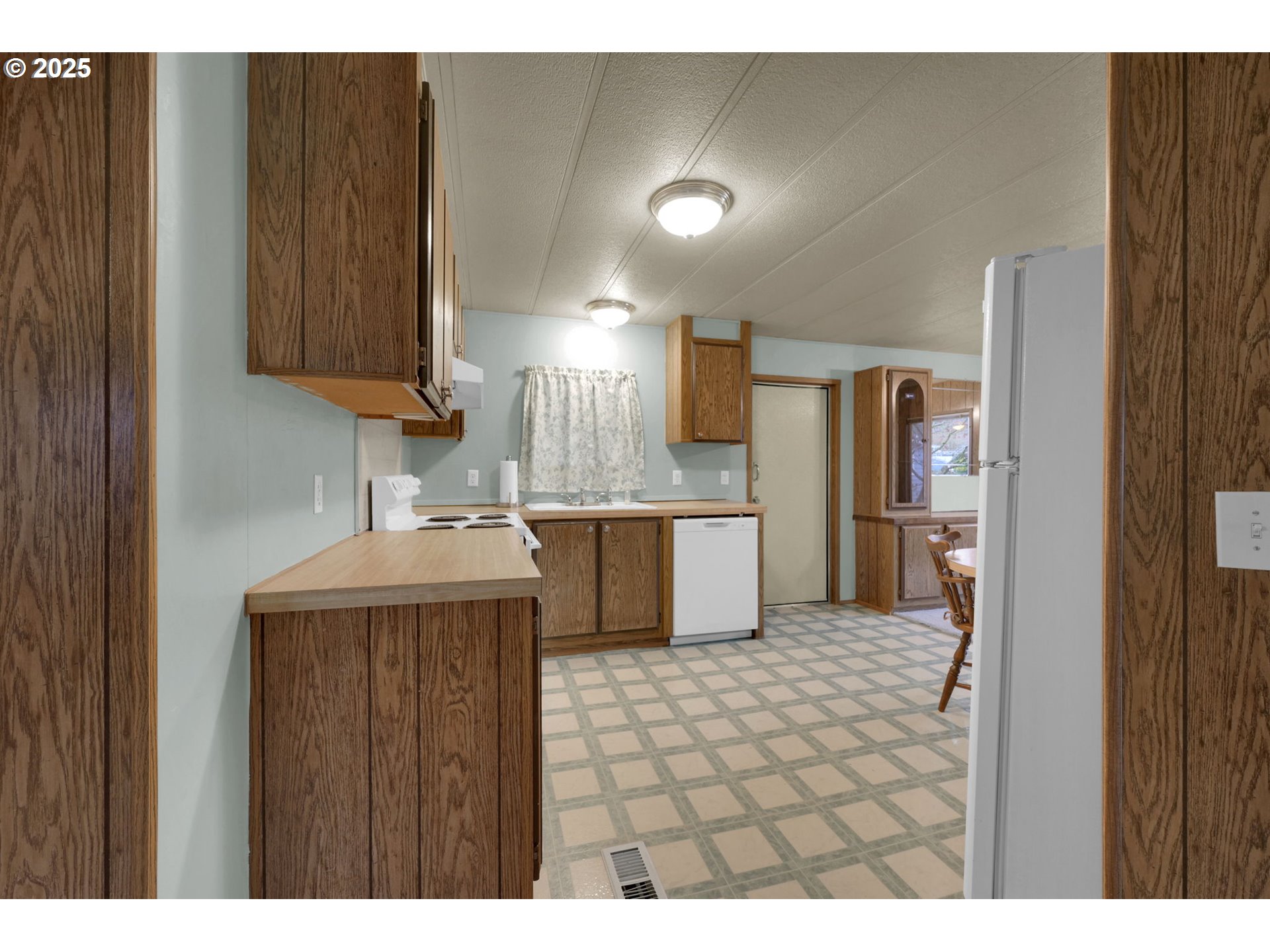 1475 Green Acres Road, Unit 13 Eugene, OR 97408 - Photo 16 of 39 a kitchen with a sink cabinets and stainless steel appliances