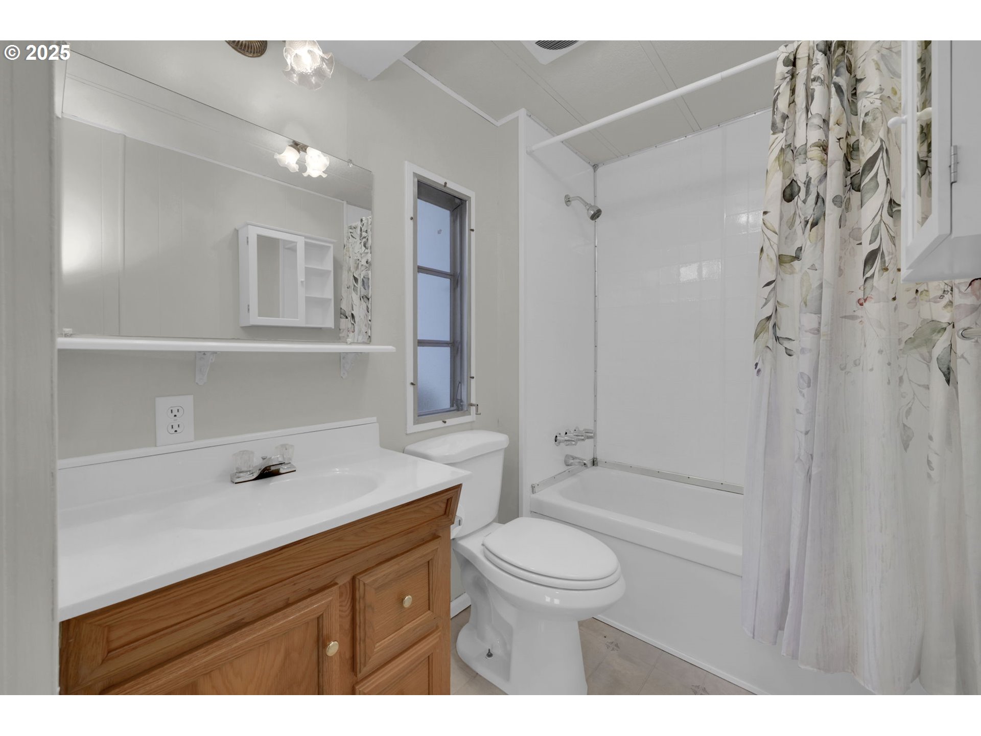 1475 Green Acres Road, Unit 13 Eugene, OR 97408 - Photo 23 of 39 a bathroom with a sink a toilet and shower