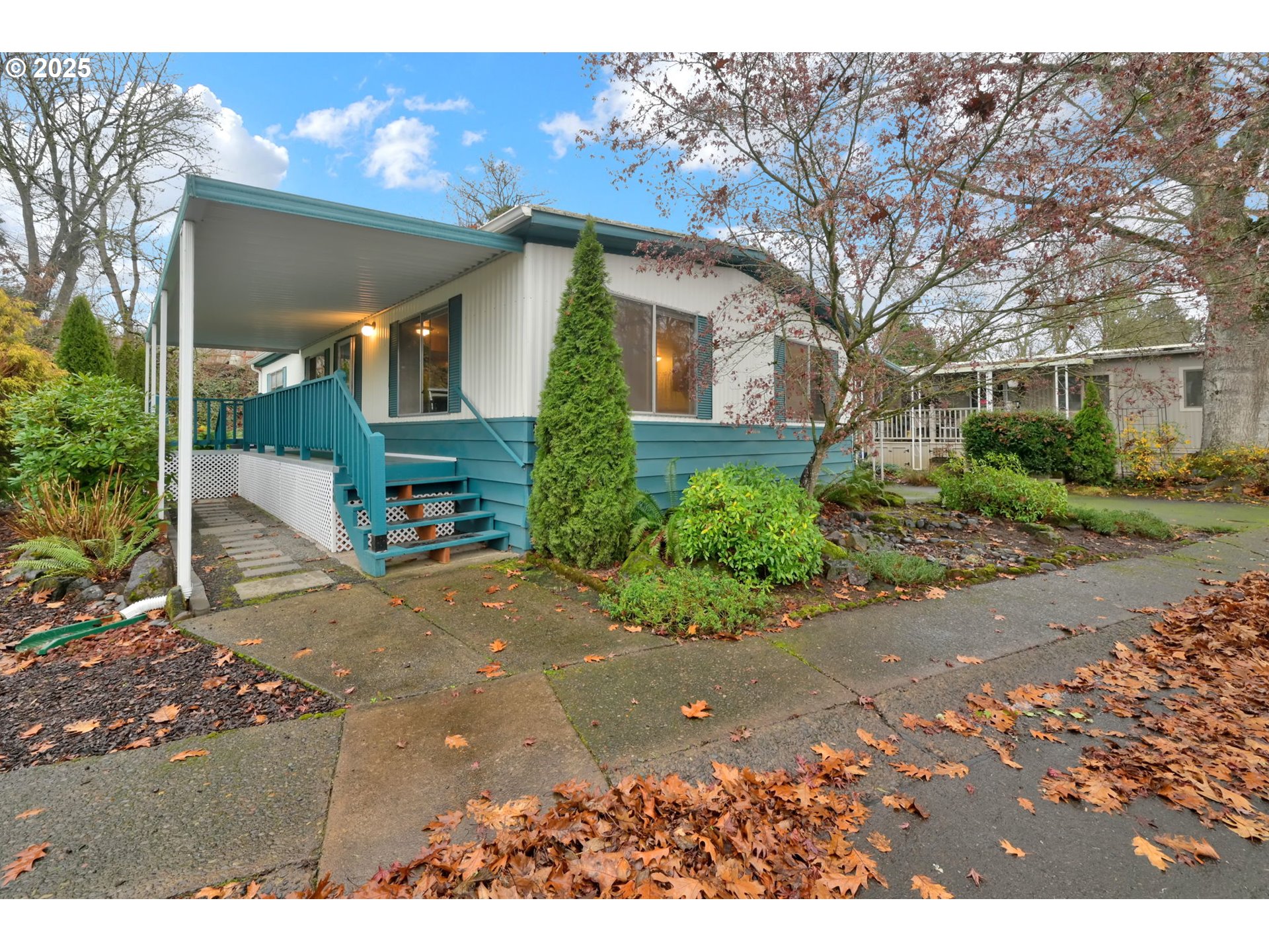 1475 Green Acres Road, Unit 13 Eugene, OR 97408 - Photo 3 of 39 a view of a house with a yard