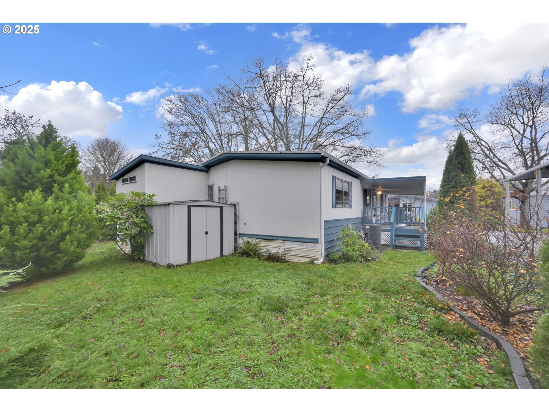 1475 Green Acres Road, Unit 13 Eugene, OR 97408 - Photo 32 of 39 a view of a house with a yard