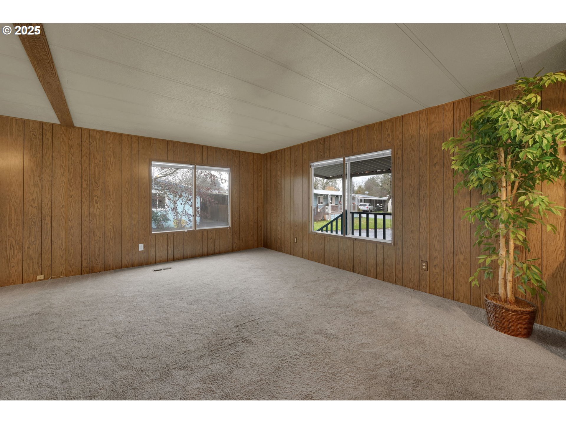 1475 Green Acres Road, Unit 13 Eugene, OR 97408 - Photo 7 of 39 a view of an empty room with a window and front door