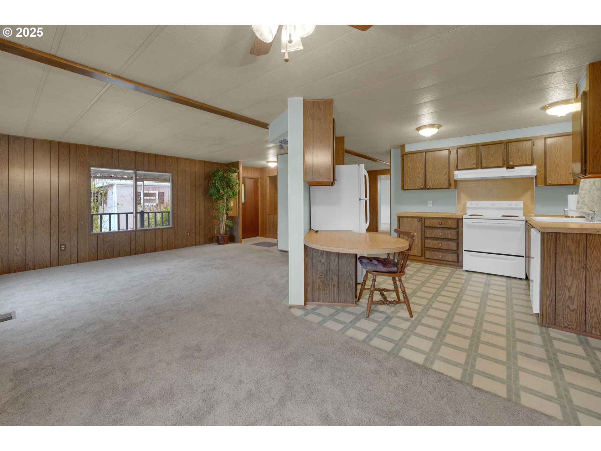 1475 Green Acres Road, Unit 13 Eugene, OR 97408 - Photo 9 of 39 a living room with furniture and a kitchen