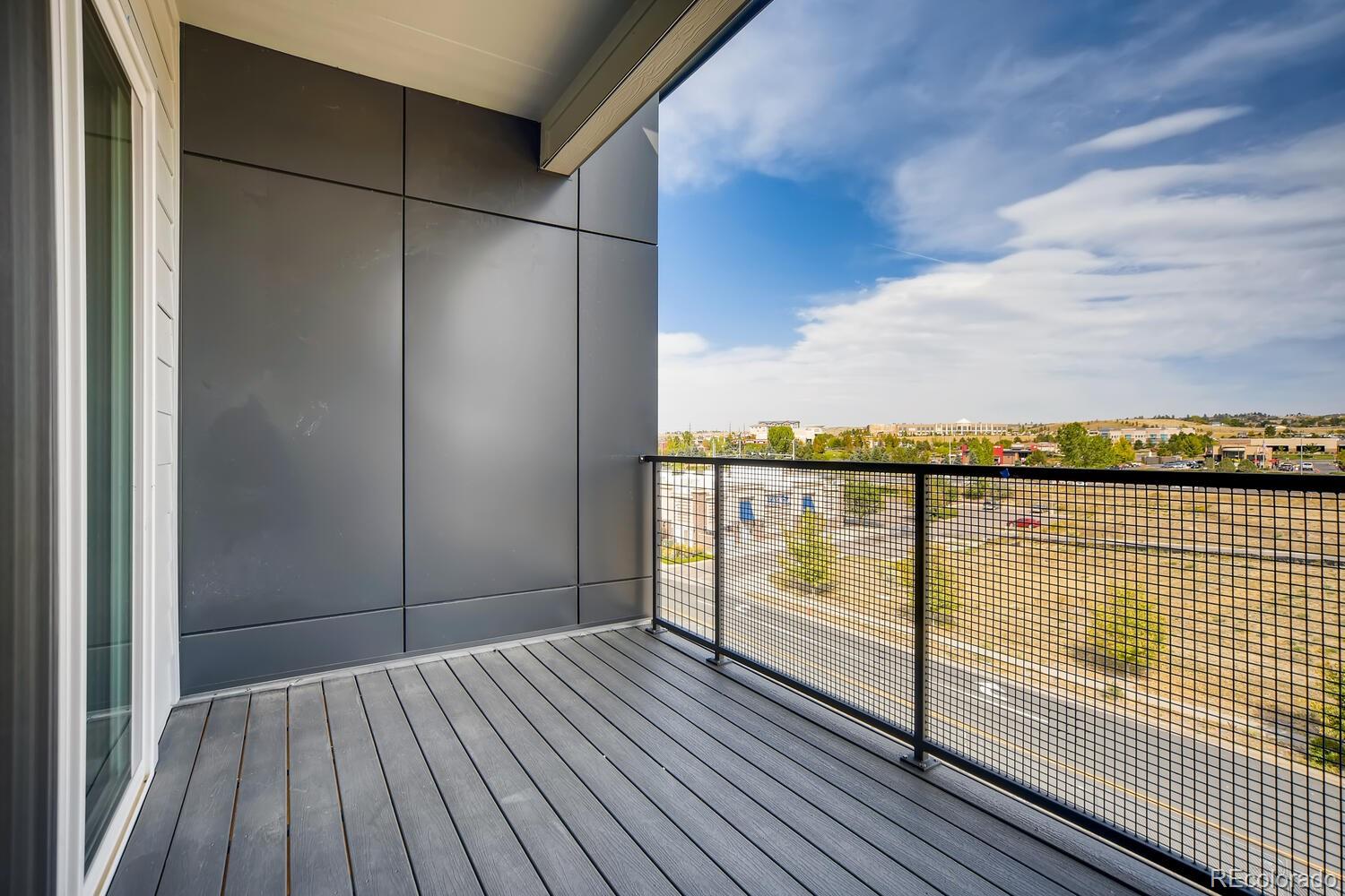 9283 Twenty Mile Road, Unit 406 Parker, CO 80134 - Photo 10 of 13 a view of a balcony with city view