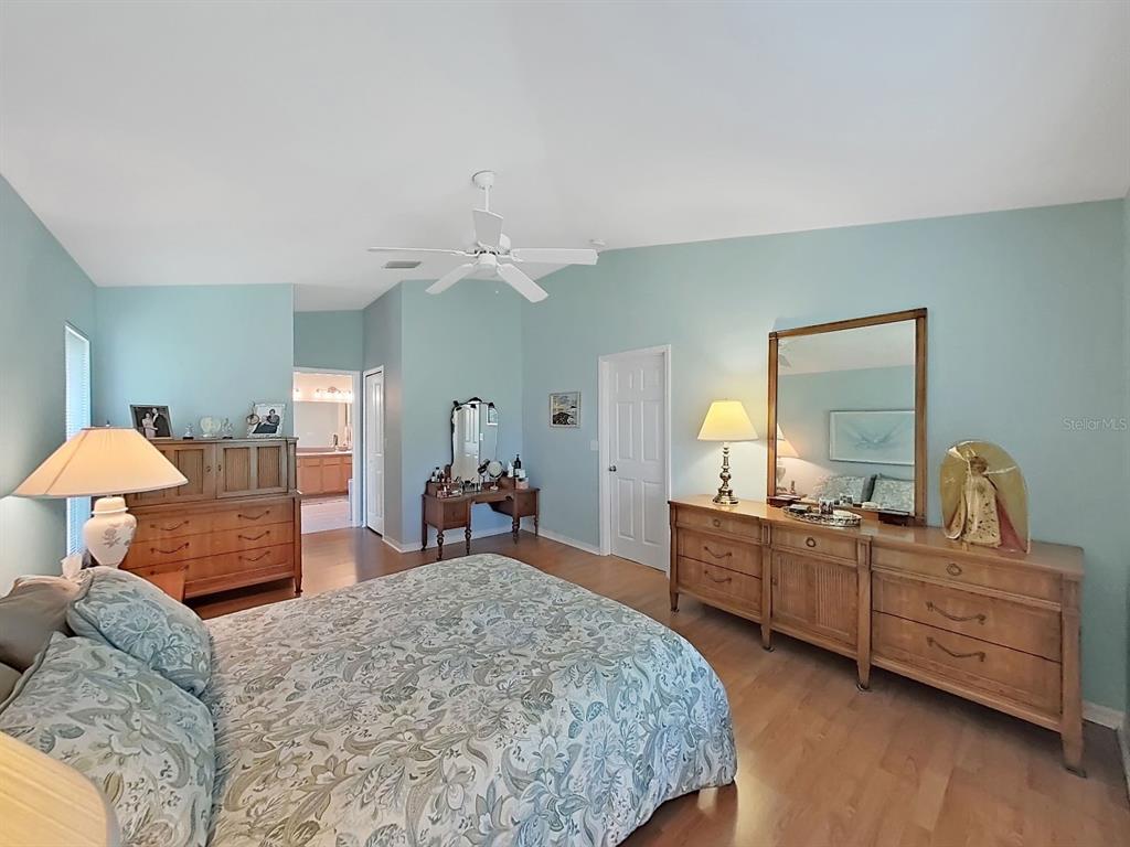 30612 Nickerson Loop Wesley Chapel, FL 33543 - Photo 25 of 47 a bedroom with furniture and a bed