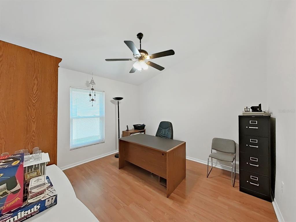 30612 Nickerson Loop Wesley Chapel, FL 33543 - Photo 32 of 47 a living room with furniture and a flat screen tv