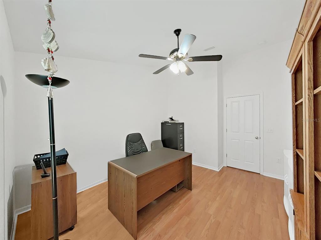 30612 Nickerson Loop Wesley Chapel, FL 33543 - Photo 33 of 47 a living room with furniture and a ceiling fan