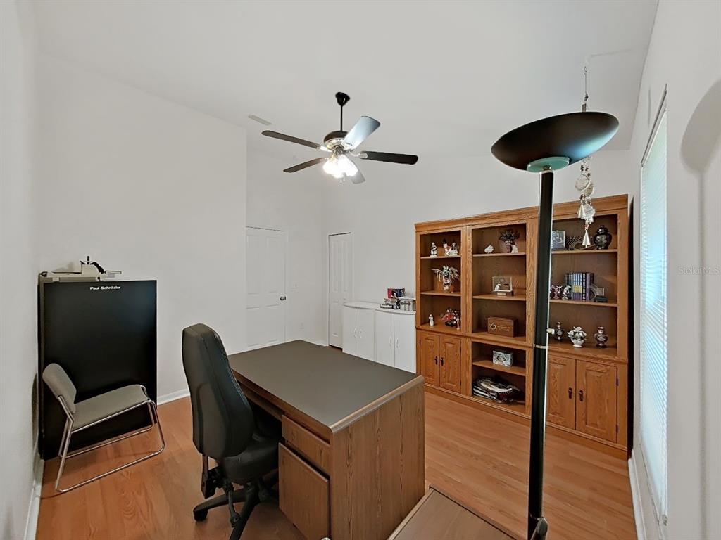 30612 Nickerson Loop Wesley Chapel, FL 33543 - Photo 34 of 47 a view of workspace and wooden floor in a room