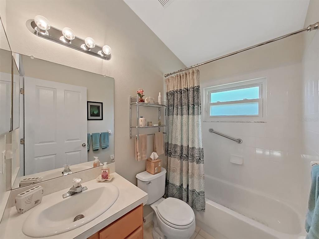 30612 Nickerson Loop Wesley Chapel, FL 33543 - Photo 35 of 47 a bathroom with a sink a toilet and shower