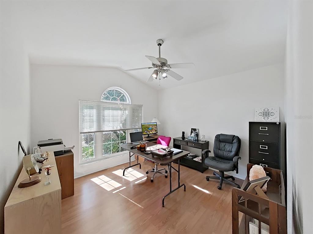 30612 Nickerson Loop Wesley Chapel, FL 33543 - Photo 36 of 47 a view of a workspace with furniture and a window