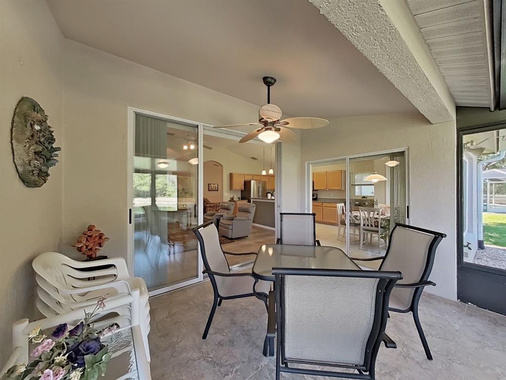 30612 Nickerson Loop Wesley Chapel, FL 33543 - Photo 42 of 47 a view of a dining room with furniture and chandelier
