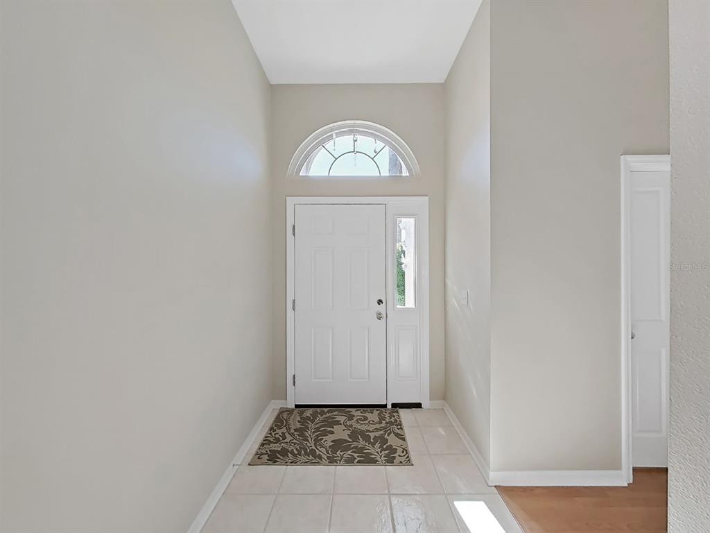 30612 Nickerson Loop Wesley Chapel, FL 33543 - Photo 5 of 47 a view of a hallway and a livingroom with a window