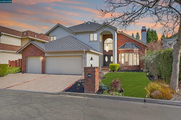 front view of a house with a small yard