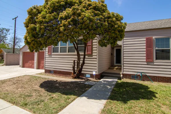 a house with trees in front of it