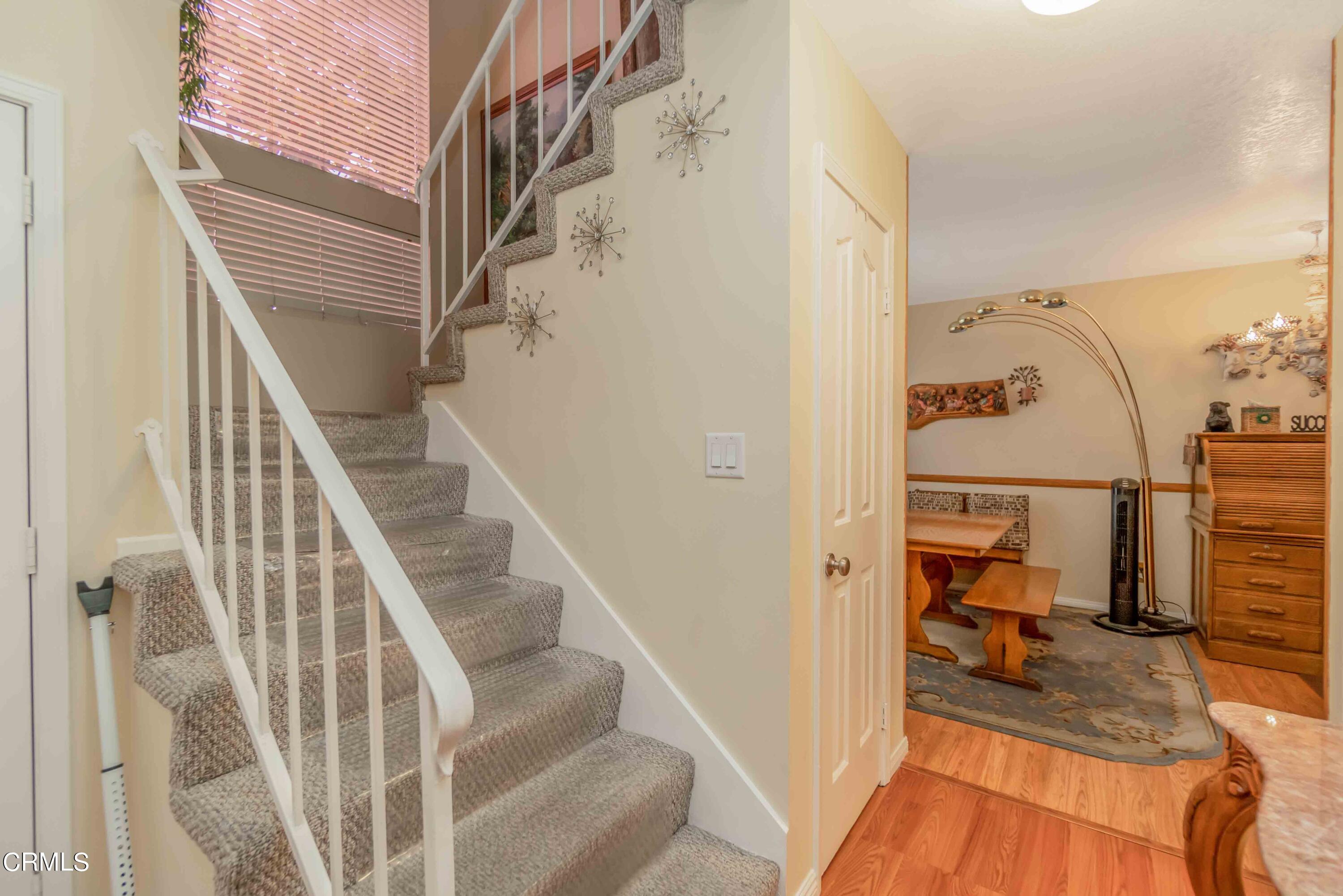 432 Johnson Road Oxnard, CA 93033 - Photo 21 of 40 a view of hallway with wooden floor and staircase