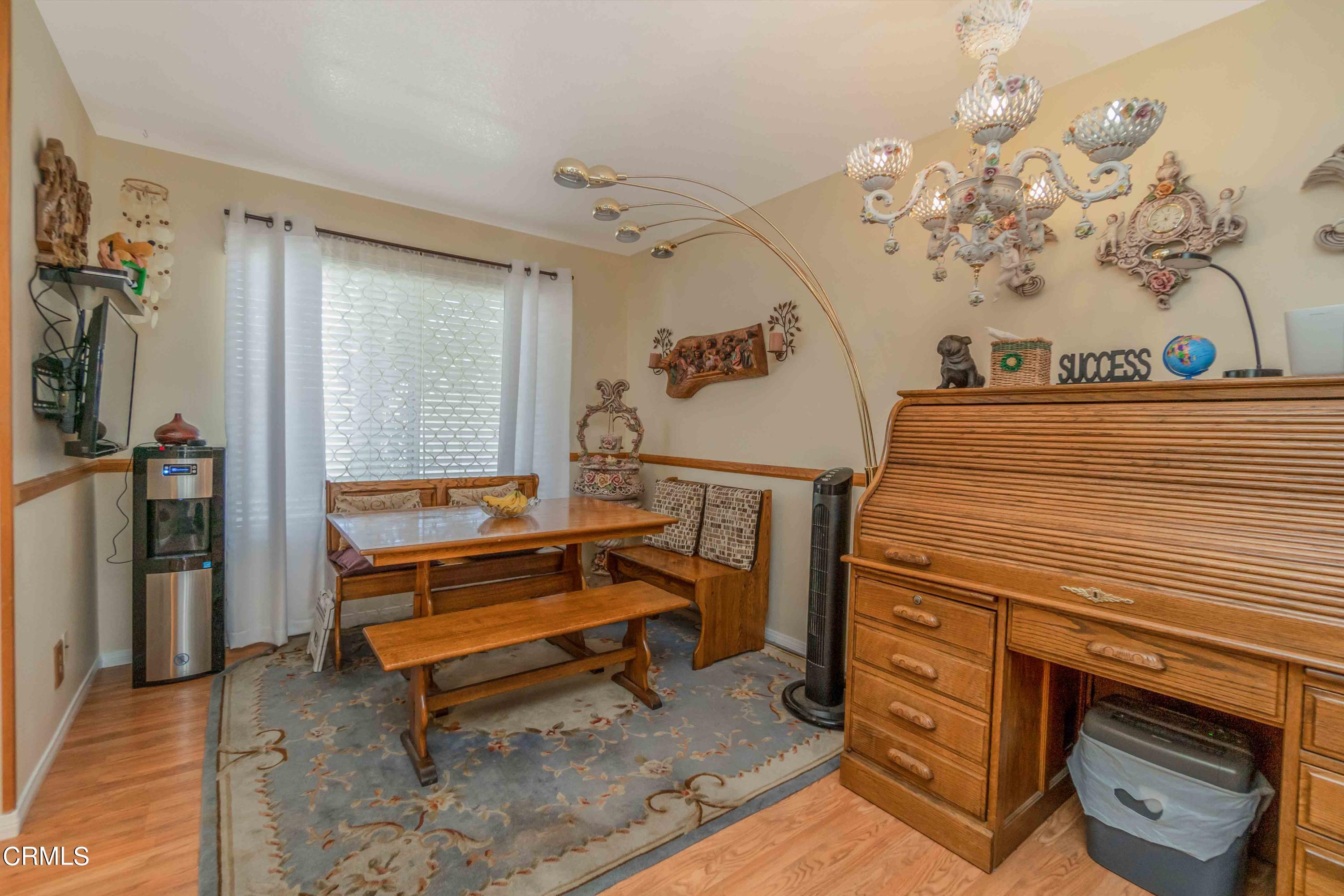 432 Johnson Road Oxnard, CA 93033 - Photo 26 of 40 a bedroom with a bed and a mirror on the dresser
