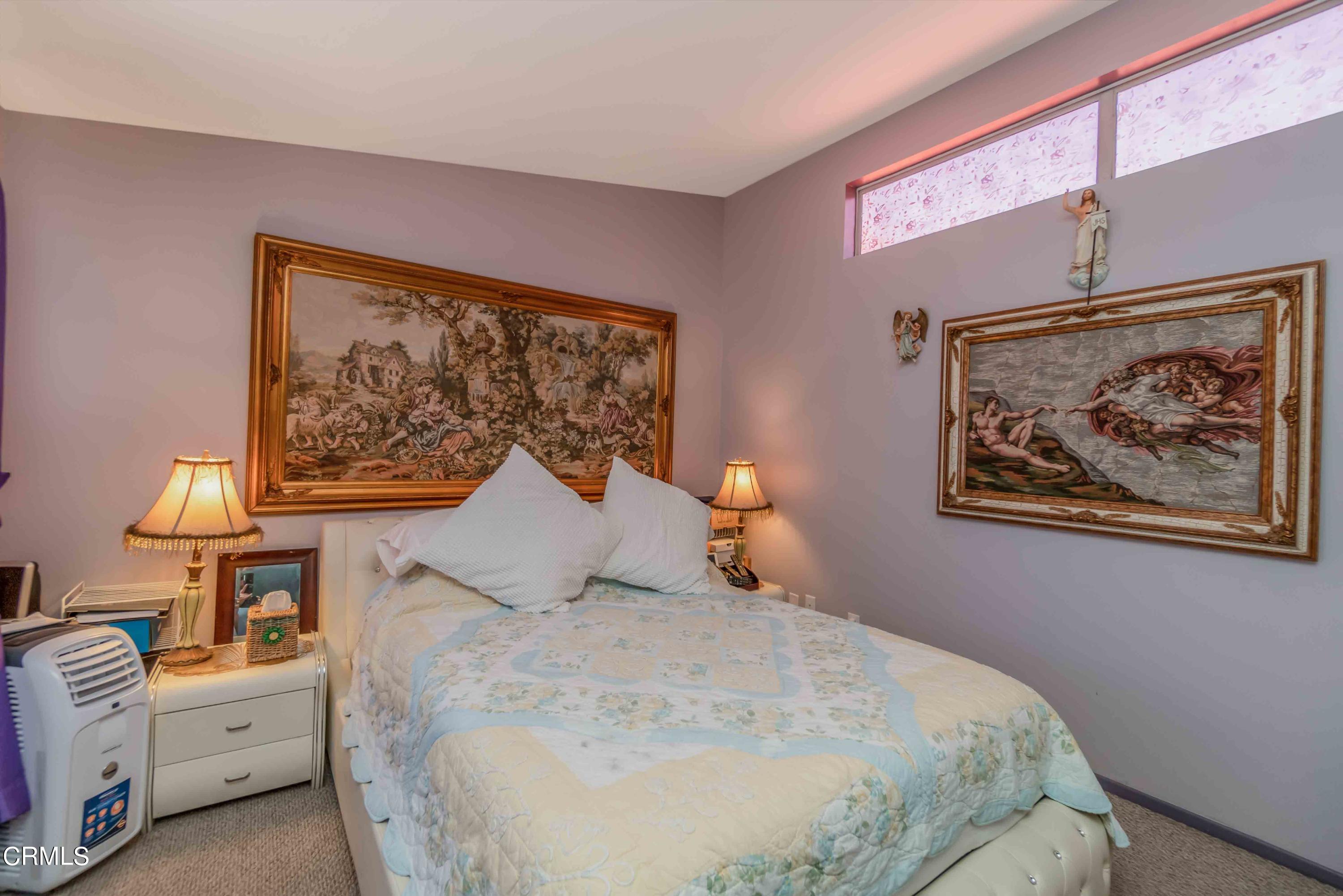 432 Johnson Road Oxnard, CA 93033 - Photo 36 of 40 a bedroom with a bed and a painting on the wall