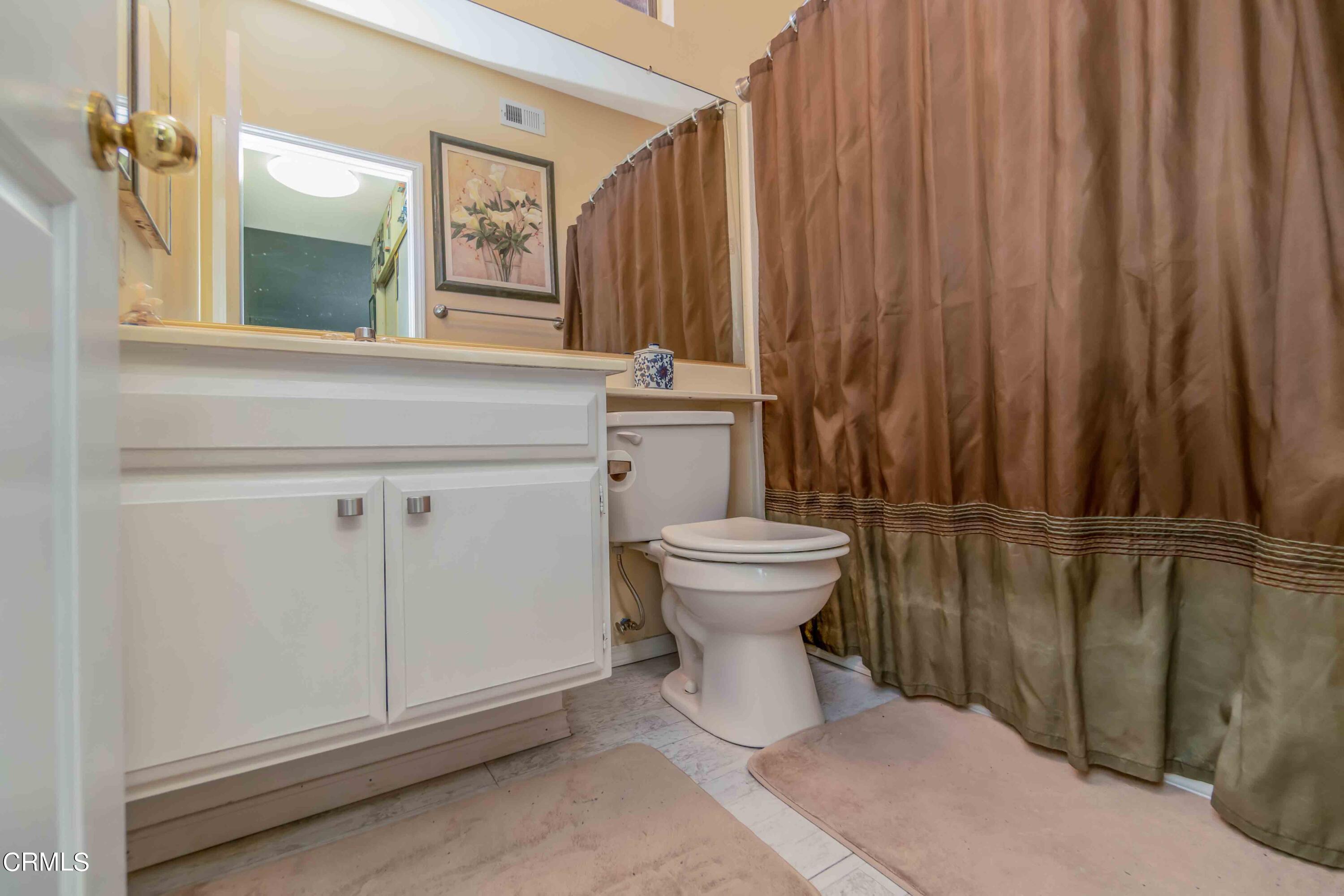 432 Johnson Road Oxnard, CA 93033 - Photo 38 of 40 a bathroom with a sink a toilet and mirror