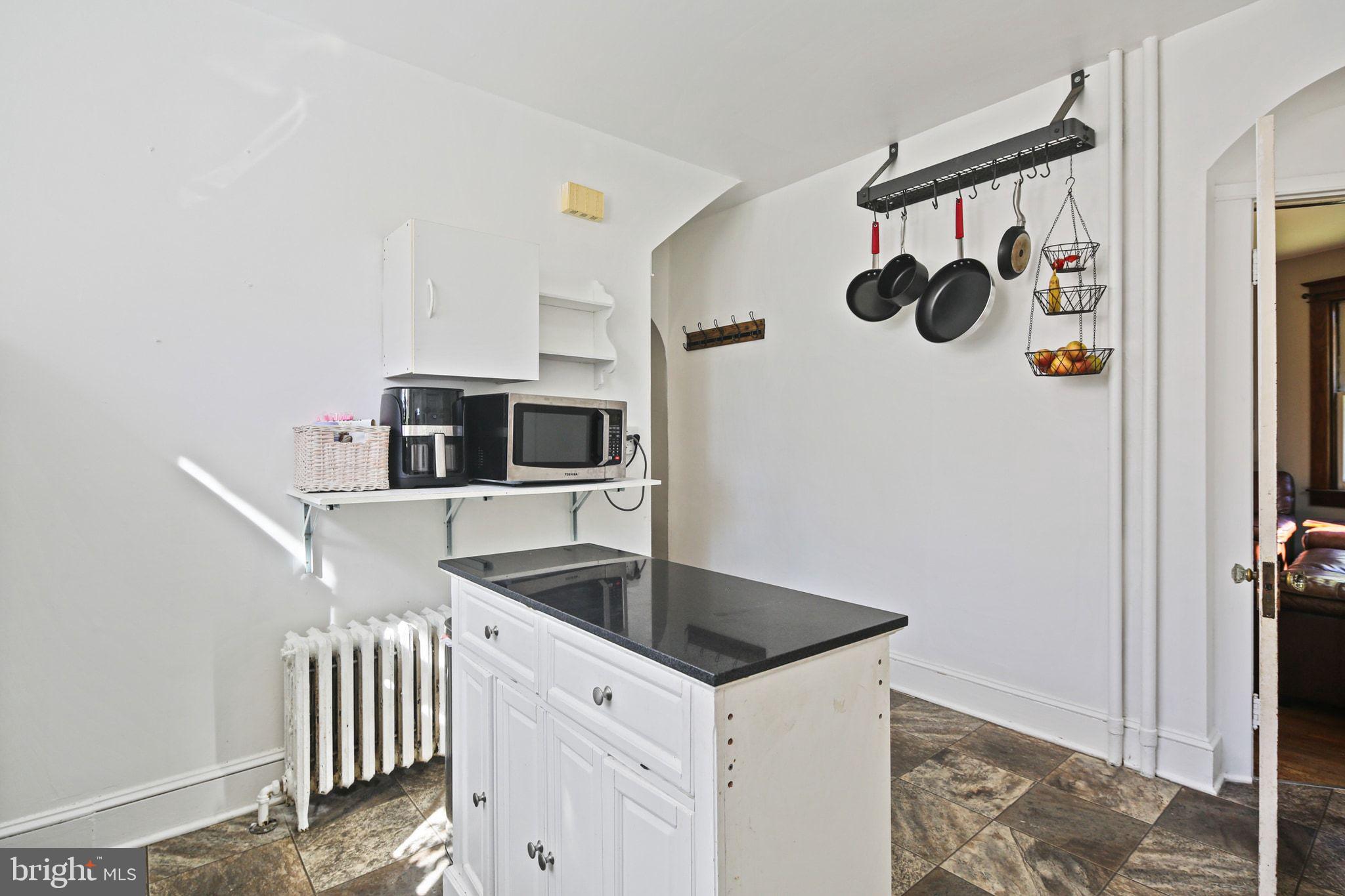 5713 Old Court Road Windsor Mill, MD 21244 - Photo 13 of 31 a kitchen with a sink and a refrigerator