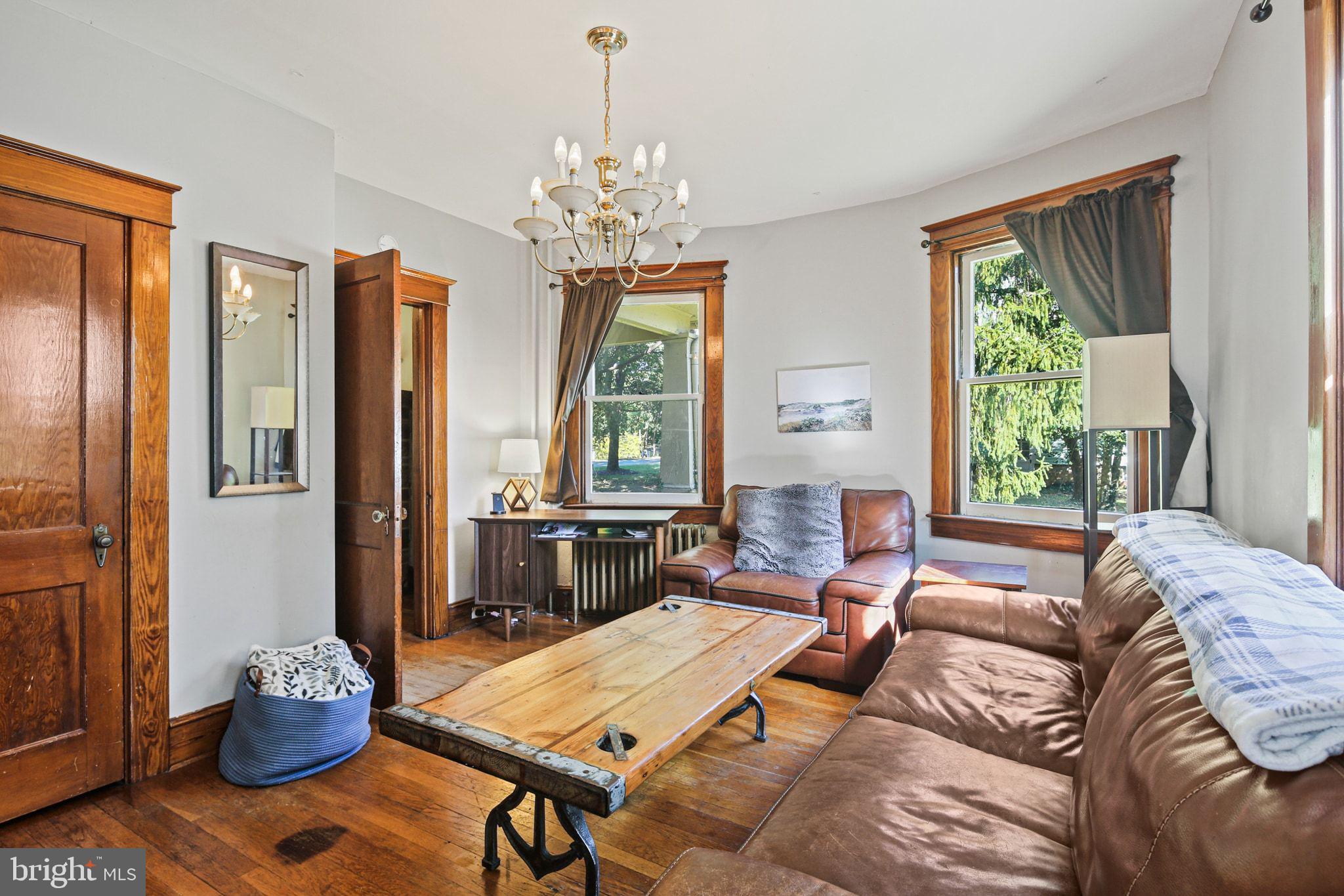 5713 Old Court Road Windsor Mill, MD 21244 - Photo 14 of 31 a living room with furniture and a chandelier