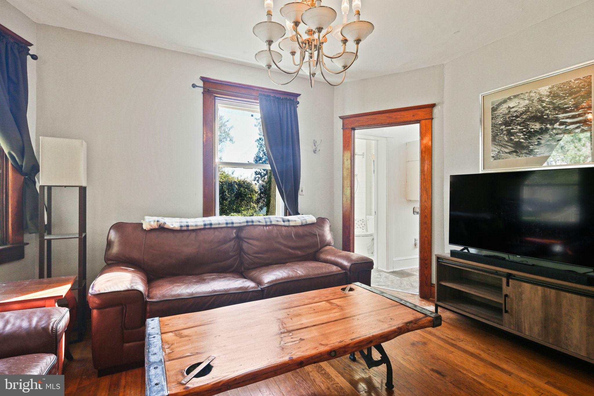 5713 Old Court Road Windsor Mill, MD 21244 - Photo 15 of 31 a living room with furniture and a flat screen tv