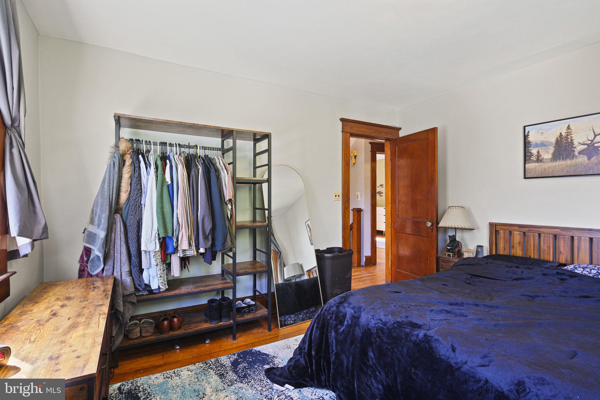 5713 Old Court Road Windsor Mill, MD 21244 - Photo 18 of 31 a bedroom with a bed and a mirror