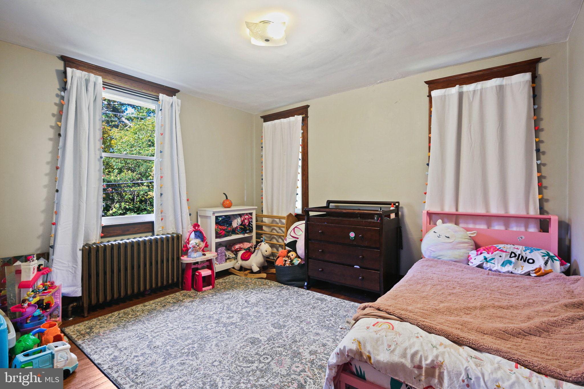 5713 Old Court Road Windsor Mill, MD 21244 - Photo 21 of 31 a bedroom with a bed and a window