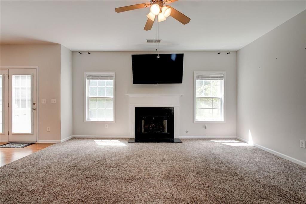 5025 Bishops Row Southwest Austell, GA 30106 - Photo 13 of 22 a view of livingroom with a fireplace fan and window