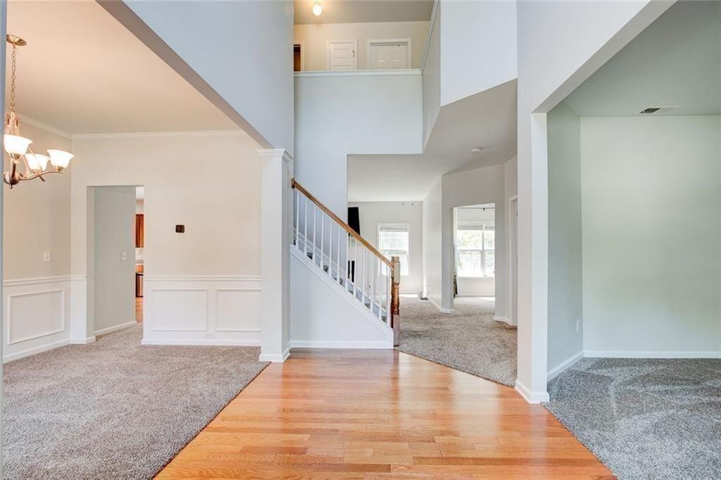 5025 Bishops Row Southwest Austell, GA 30106 - Photo 5 of 22 a view of staircase with white walls and door