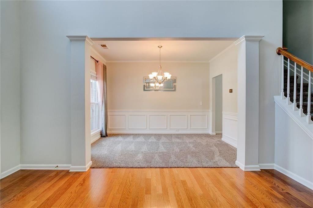 5025 Bishops Row Southwest Austell, GA 30106 - Photo 6 of 22 an empty room with wooden floor and windows