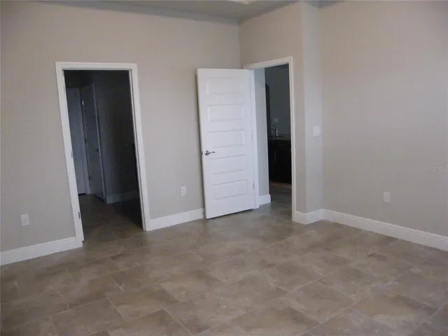 a white toilet sitting next to a shower