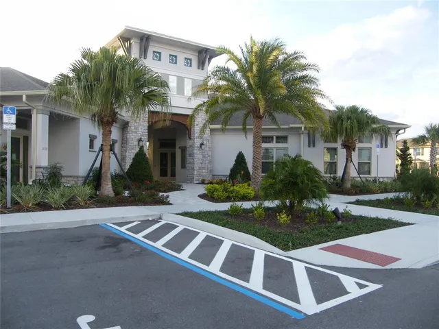 a view of a patio with table and chairs and potted plants