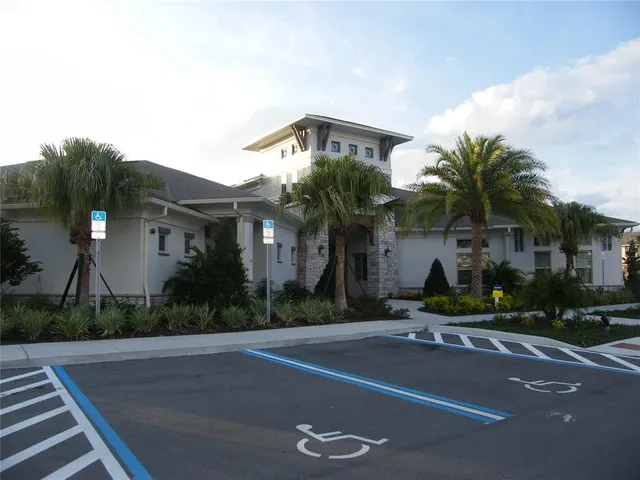a view of dining room with furniture and chandelier