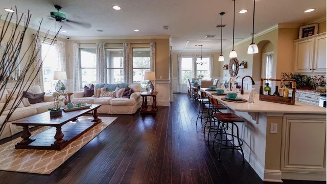 a kitchen with sink a stove and cabinets