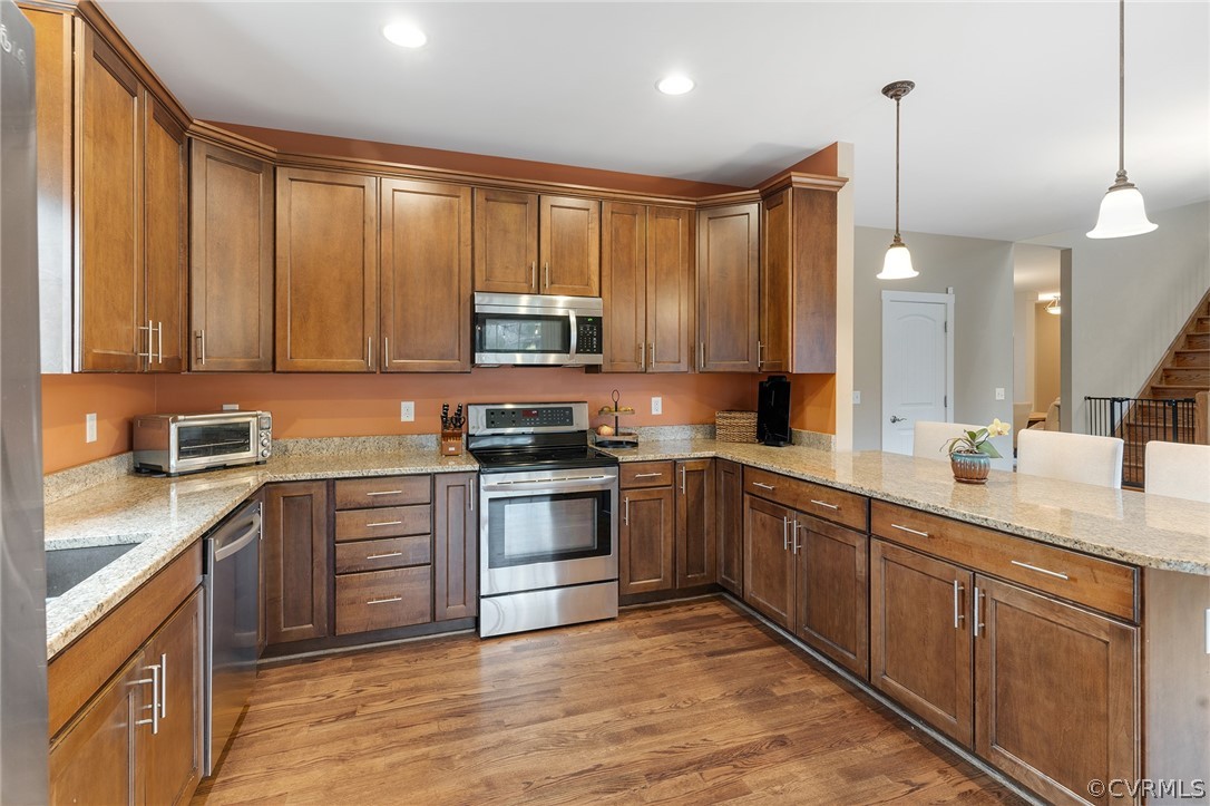 6150 Advance Mills Road Ruckersville, VA 22968 - Photo 20 of 50 a kitchen with stainless steel appliances granite countertop a stove top oven a sink dishwasher a refrigerator and a microwave