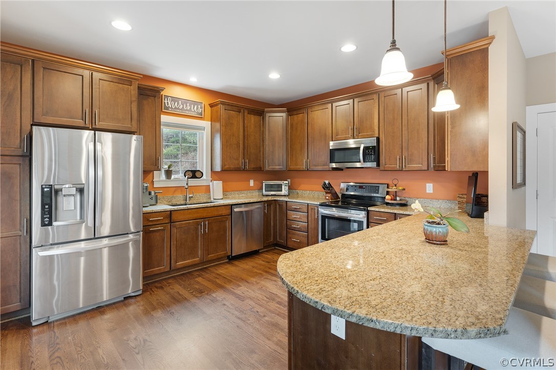 6150 Advance Mills Road Ruckersville, VA 22968 - Photo 21 of 50 a kitchen with granite countertop a refrigerator a sink dishwasher with a dining table and chairs