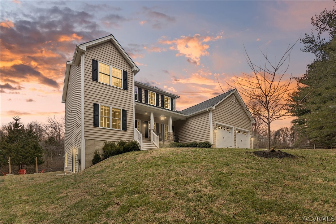 6150 Advance Mills Road Ruckersville, VA 22968 - Photo 3 of 50 a front view of a house with a yard