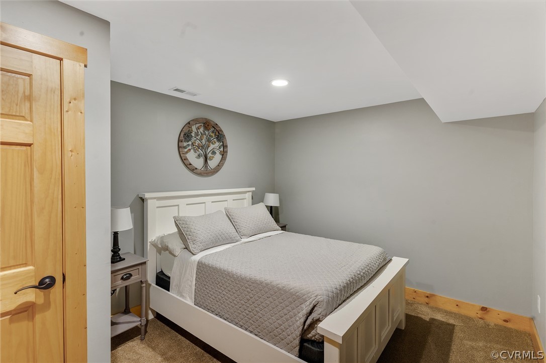 6150 Advance Mills Road Ruckersville, VA 22968 - Photo 33 of 50 a bedroom with a bed and a wall painting