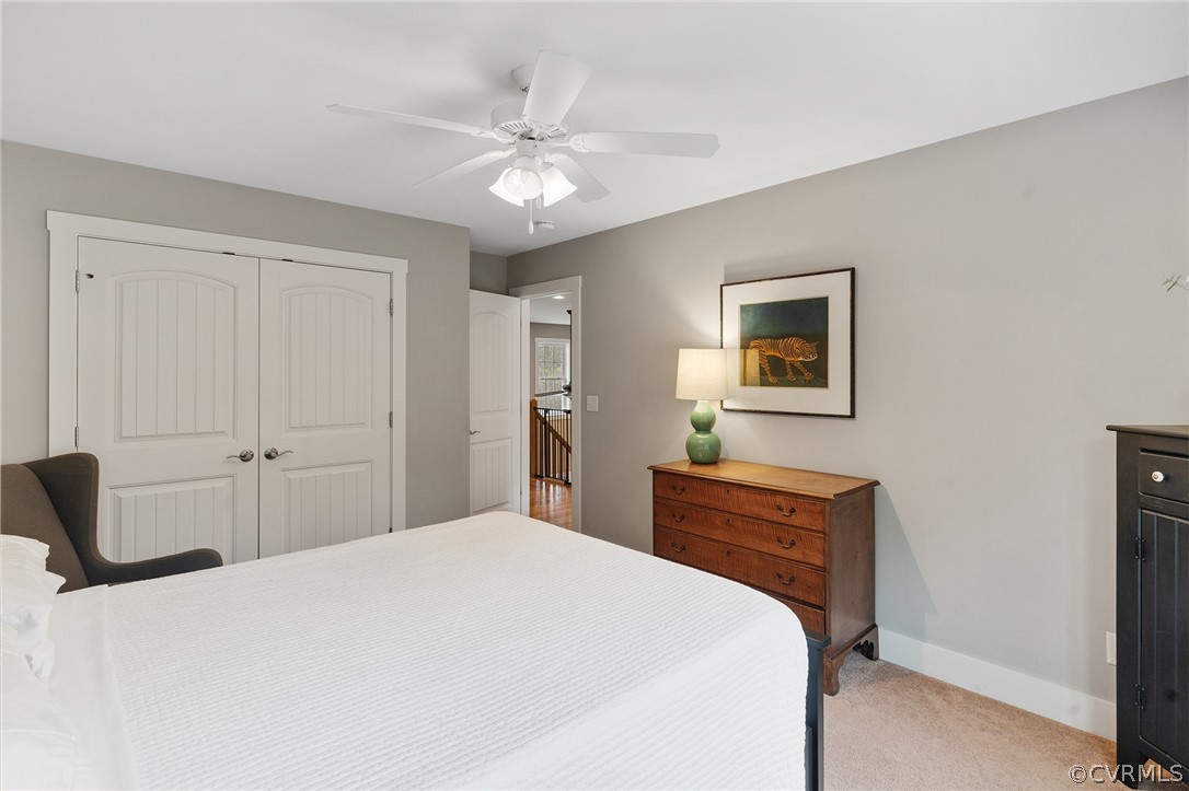 6150 Advance Mills Road Ruckersville, VA 22968 - Photo 34 of 50 a bedroom with a bed and a chandelier