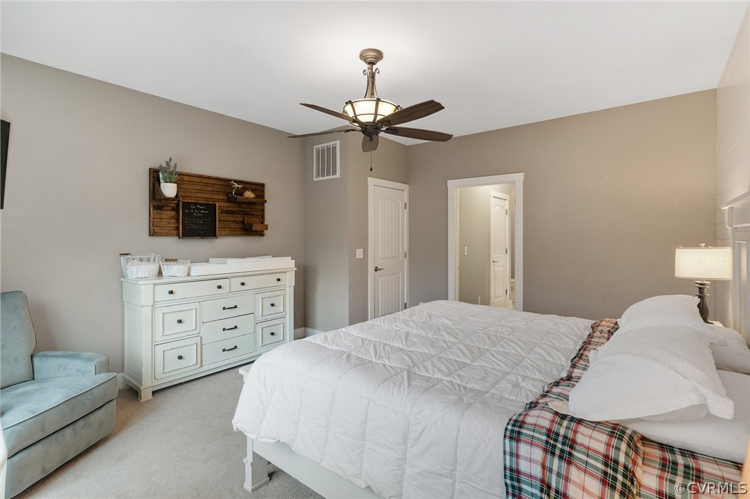 6150 Advance Mills Road Ruckersville, VA 22968 - Photo 37 of 50 a bedroom with a bed and a flat screen tv