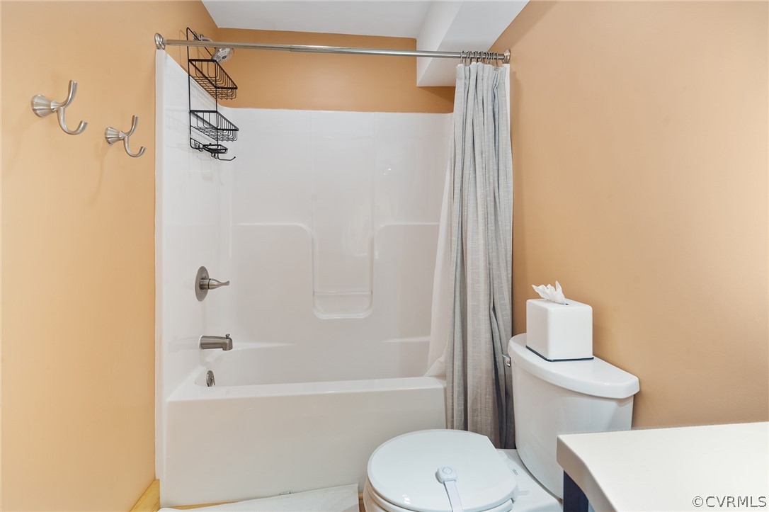 6150 Advance Mills Road Ruckersville, VA 22968 - Photo 41 of 50 a white toilet and shower sitting next to a bathroom