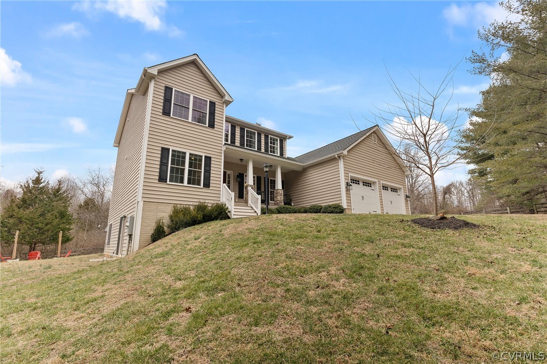 6150 Advance Mills Road Ruckersville, VA 22968 - Photo 5 of 50 a front view of a house with a yard