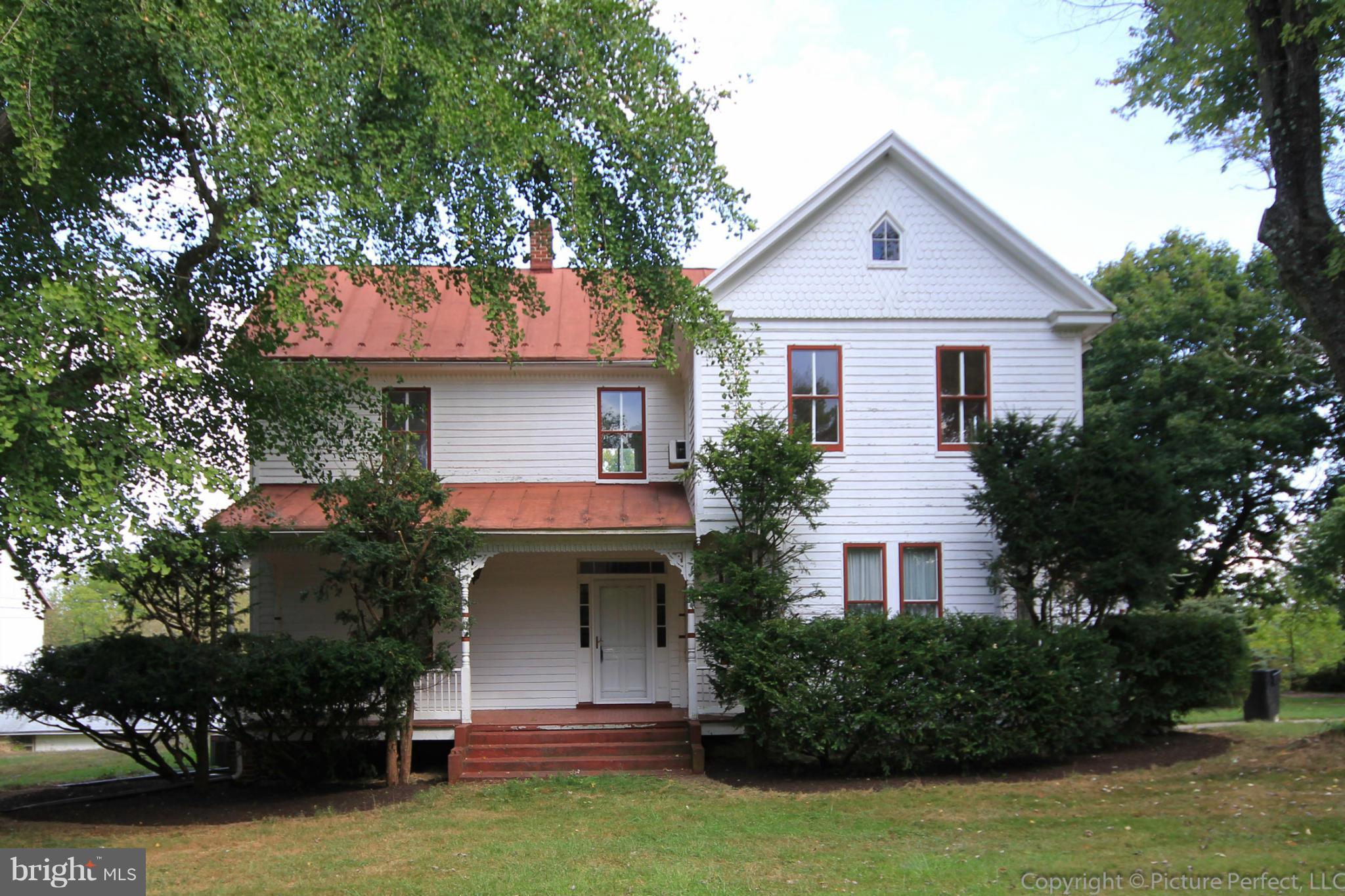 1801 Long Corner Road Mount Airy, MD 21771 - Photo 2 of 30 a front view of a house with a garden